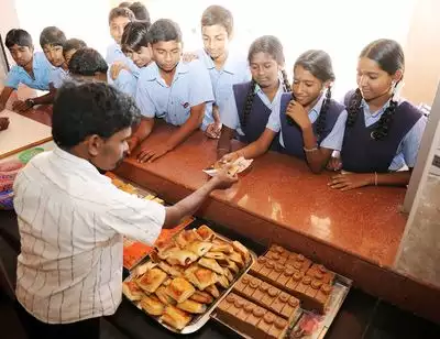 Students examining food items in school